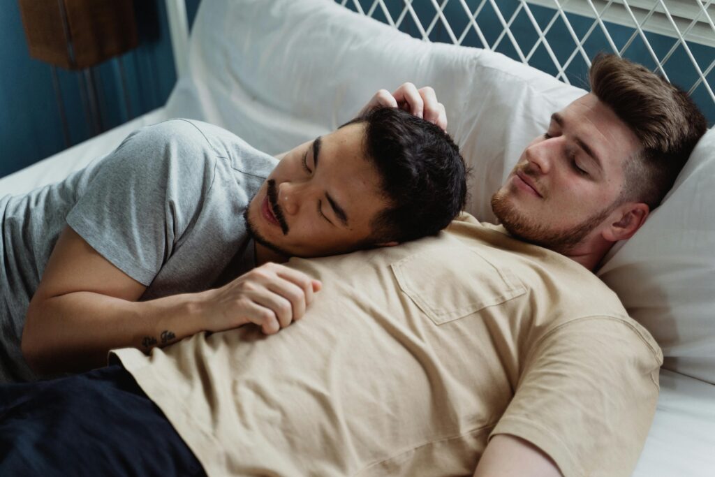 Gay Couple Cuddling on Bed